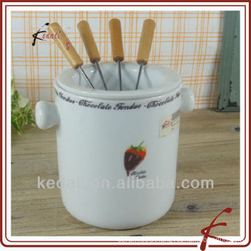 Porcelain cheese fondue set with fork